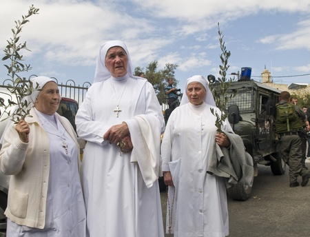 JERUSALEM - APRIL 01 : Unidentified nuns take part in the Palm sunday procession in Jerusalem on...