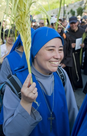 JERUSALEM - APRIL 01 : Unidentified nun take part in the Palm sunday procession in Jerusalem on...