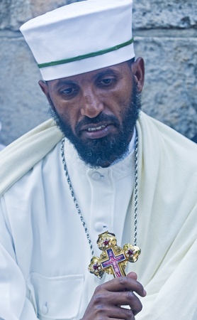 JERUSALEM - APRIL 14 : Ethiopian Orthodox priest await the start of the Holy fire ceremony at the Ethiopian section of the Holy Sepulcher in Jerusalm Israel on April 14 2012のeditorial素材