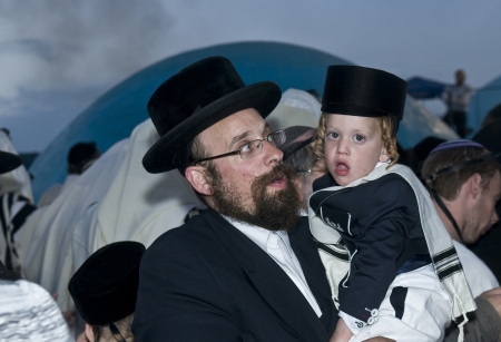 MERON , ISRAEL - MAY 10 : Orthodox Jews celebrates Halake in Bar Yochai tomb in Meron , Israel on May 10 2012 , Halake is first haircut ceremony celebrated in Lag Ba'omer のeditorial素材