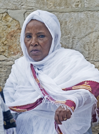 JERUSALEM - APRIL 14 : Ethiopian Orthodox worshiper await the start of the Holy fire ceremony at the Ethiopian section of the Holy Sepulcher in Jerusalm Israel on April 14 2012のeditorial素材