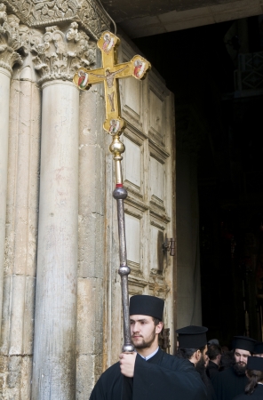 JERUSALEM - APRIL 13 : Greek Orthodox monk carry across at the Church of the Holy Sepulchre in Jerusalem Israel during Good Friday on April 13 2012 のeditorial素材