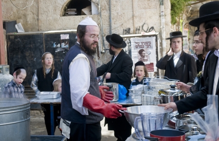 JERUSALEM - APRIL 05 : An Ultra Orthodox man is preparing to the Jewish holiday of Passover by...
