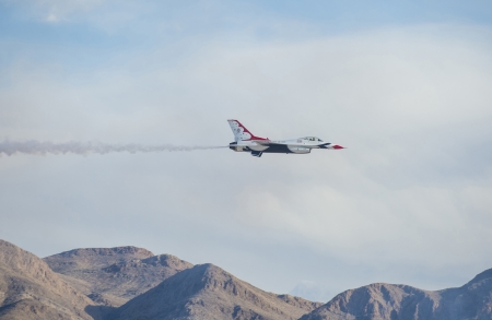 LAS VEGAS - NOVEMBER 11: Thunderbird F-16 Aircraft performing in an air show on November 11, 2012 in Las Vegas,USA. The Thunderbirds are the air demonstration squadron of the United States Air Forceのeditorial素材
