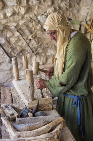 NAZARETH, ISRAEL - OCT 15 : Palestinian carpenter work with traditional tools in October 15 2012 at Nazareth Village, historical re-creation of Nazareth as it was at the time of Christのeditorial素材