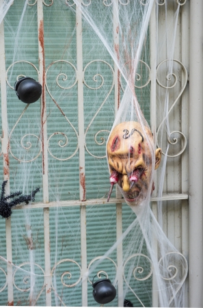 Scary Halloween decorations in front of a windowのeditorial素材