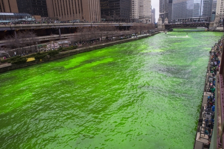 CHICAGO - MARCH 16: The Chicago River is dyed green for St. Patrick's Day in Chicago on March 16, 2013のeditorial素材
