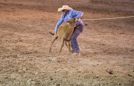LAS VEGAS - MAY 17 : Cowboy Participant in a Calf roping Competition at the Helldorado Days Professional Rodeo in Las Vegas , USA on May 17 2013 のeditorial素材