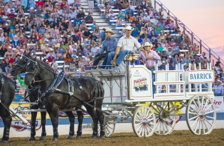 RENO , USA - JUNE 30 : Horse-drawn wagon Participate at the Reno Rodeo a Professional Rodeo held in Reno Nevada , USA on June 30 2013 のeditorial素材