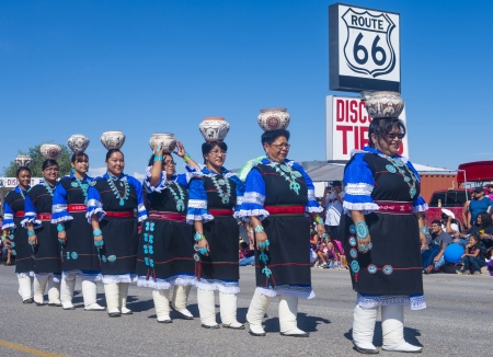 GALLUP , NEW MEXICO - AUGUST 10 : Zuni tribe women with traditional costume participates at the 92 annual Inter-tribal ceremonial parade on August 10 , 2013 in Gallup New-Mexicoのeditorial素材