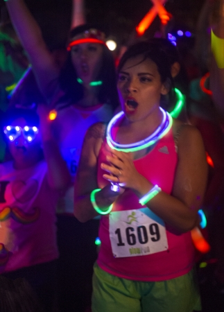 LAS VEGAS - OCT 14 : Runners participates at the GlowRun race in Las Vegas on October 14 2013  , The Glowrun is 5K Annual race where the runners run with glowing and colorful costumesのeditorial素材