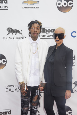 LAS VEGAS - MAY 18 : Rapper Wiz Khalifa (L) and model Amber Rose attend the 2014 Billboard Music Awards at the MGM Grand Garden Arena on May 18 , 2014 in Las Vegas.のeditorial素材