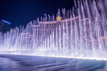 LAS VEGAS - JULY 03 : Bellagio hotel and the dancing fountains in Las Vegas on July 03 2014. Bellagio is a luxury hotel and casino located on the Las Vegas Strip. The Bellagio opened on 1998.のeditorial素材