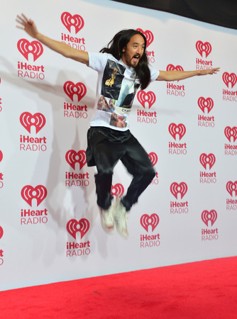 LAS VEGAS - SEP 19: DJ Steve Aoki attends the 2014 iHeartRadio Music Festival at the MGM Grand Garden Arena on September 19, 2014 in Las Vegas.のeditorial素材