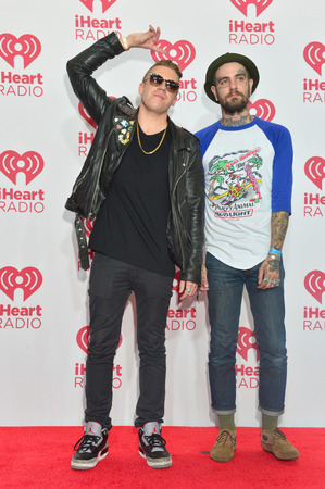 LAS VEGAS - SEP 20 : Rapper Macklemore (L) and musician Christopher Mansfield of Fences attends the 2014 iHeartRadio Music Festival at the MGM Grand  Arena on September 19, 2014 in Las Vegas.のeditorial素材