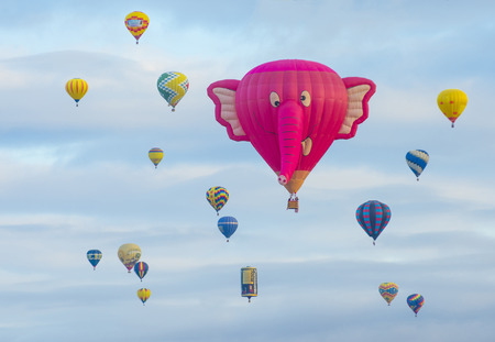 ALBUQUERQUE, NEW MEXICO - OCT 11: Balloons fly over Albuquerque on October 11, 2014 in Albuquerque, New Mexico. Albuquerque balloon fiesta is the biggest balloon event in the world.のeditorial素材