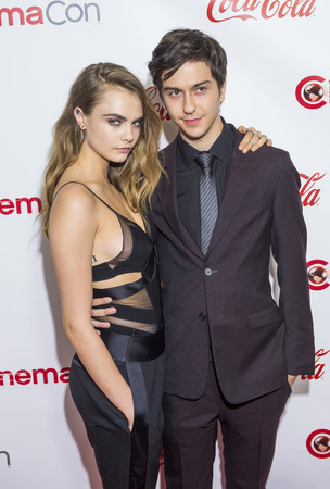 LAS VEGAS - APR 23 : Actors Cara Delevingne (L) and Nat Wolff, winners of CinemaCon's Rising Stars of the year award, attends the 2015 Big Screen Achievement Awards on April 23 2015 in Las Vegasのeditorial素材