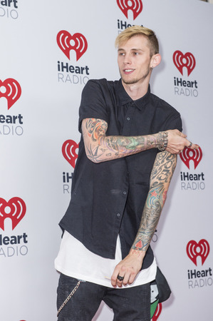 LAS VEGAS - SEP 19 : Rapper Machine Gun Kelly attends the 2015 iHeartRadio Music Festival at MGM Grand Garden Arena on September 19, 2015 in Las Vegas, Nevada.のeditorial素材
