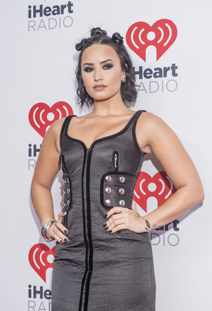 LAS VEGAS - SEP 18 : Singer/songwriter Demi Lovato attends the 2015 iHeartRadio Music Festival at the MGM Grand Garden Arena on September 18, 2015 in Las Vegas.のeditorial素材