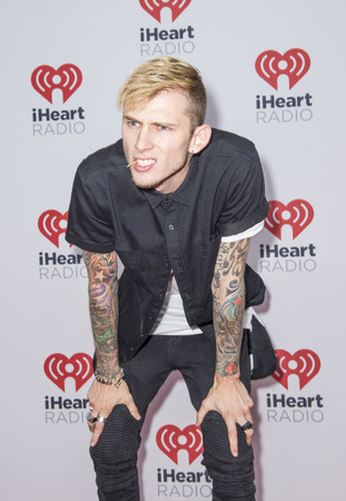 LAS VEGAS - SEP 19 : Rapper Machine Gun Kelly attends the 2015 iHeartRadio Music Festival at MGM Grand Garden Arena on September 19, 2015 in Las Vegas, Nevada.のeditorial素材