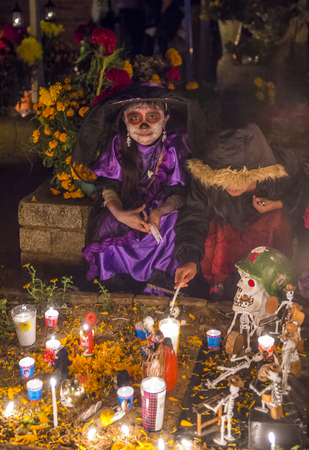OAXACA , MEXICO - NOV 02 : Unidentified people on a cemetery during Day of the Dead in Oaxaca, Mexico on November 02 2015. The Day of the Dead is one of the most popular holidays in Mexicoのeditorial素材