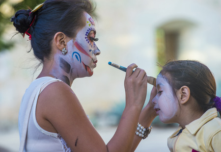 OAXACA , MEXICO - NOV 02 : Unidentified participant has his face covered with makeup on a carnival of the Day of the Dead in Oaxaca, Mexico on November 02 2015.のeditorial素材