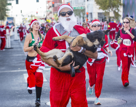 LAS VEGAS - DEC 05 : An Unidentified participants at the Las Vegas Great Santa Run on December 05 2015 in Las Vegas Nevada. It is the largest gatherings of Santa runners in the world.のeditorial素材