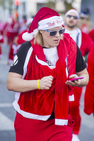 LAS VEGAS - DEC 05 : An Unidentified participant at the Las Vegas Great Santa Run on December 05 2015 in Las Vegas Nevada. It is the largest gatherings of Santa runners in the world.のeditorial素材