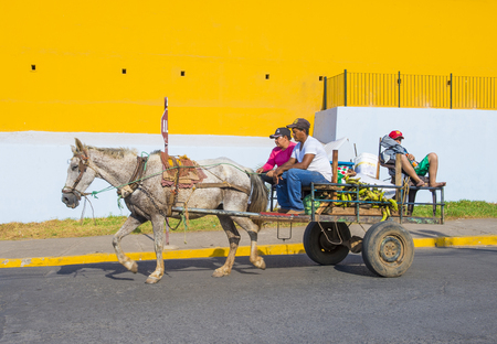 GRANADA , NICARAGUA - MARCH 20 : Horse drawn wagon in Granada Nicaragua on March 20 2016. Granada was founded in 1524 and it's the first European city in mainland Americaのeditorial素材
