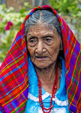 PANCHIMALCO , EL SALVADOR - MAY 08 : Portrait of an old Salvadoran woman during the Flower & Palm Festival in Panchimalco, El Salvador on May 08 2016のeditorial素材