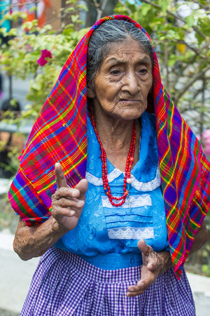 PANCHIMALCO , EL SALVADOR - MAY 08 : Portrait of an old Salvadoran woman during the Flower & Palm Festival in Panchimalco, El Salvador on May 08 2016のeditorial素材