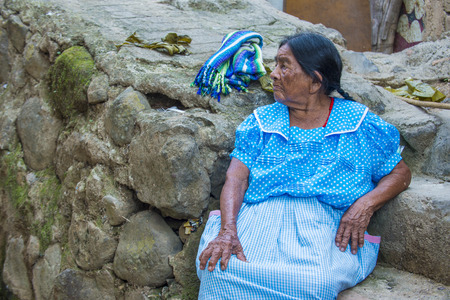 PANCHIMALCO , EL SALVADOR - MAY 08 : Portrait of an old Salvadoran woman during the Flower & Palm Festival in Panchimalco, El Salvador on May 08 2016のeditorial素材