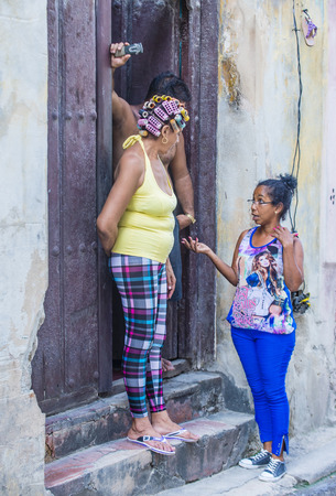 HAVANA, CUBA - JULY 18 : Cuban people stand in old Havana street on July 18 2016. The historic center of Havana is UNESCO World Heritage Site since 1982.のeditorial素材