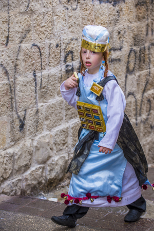 JERUSALEM - MARCH 13 : Ultra Orthodox child during Purim in Mea Shearim Jerusalem on March 13 2017 , Purim is a Jewish holiday celebrates the salvation of the jews from genocide in ancient Persiaのeditorial素材