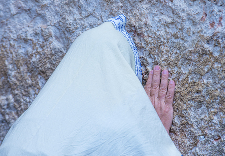 JERUSALEM - APRIL 13 : Orthodox jewish man prays in The western wall during Passover on April 13 2017 , The Western wall is important Jewish religious site located in the Old City of Jerusalemのeditorial素材