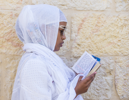 JERUSALEM - APRIL 15 : Ethiopian Orthodox worshiper waiting for the Holy fire ceremony to begin at the Ethiopian section of the Holy Sepulcher in Jerusalm Israel on April 15 2017のeditorial素材