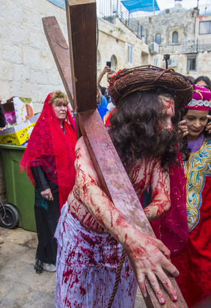 JERUSALEM - APRIL 14 : Christian pilgrims re-enact the crucifixtion of Jesus along the Via Dolorosa in Jerusalem during Good friday on April 14 2017のeditorial素材