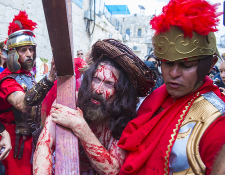 JERUSALEM - APRIL 14 : Christian pilgrims re-enact the crucifixtion of Jesus along the Via Dolorosa in Jerusalem during Good friday on April 14 2017のeditorial素材
