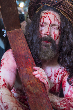 JERUSALEM - APRIL 14 : Christian pilgrim re-enact the crucifixtion of Jesus along the Via Dolorosa in Jerusalem during Good friday on April 14 2017のeditorial素材