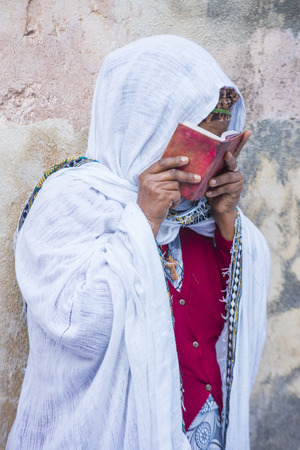 JERUSALEM - APRIL 15 : Ethiopian Orthodox worshiper waiting for the Holy fire ceremony to begin at the Ethiopian section of the Holy Sepulcher in Jerusalm Israel on April 15 2017のeditorial素材