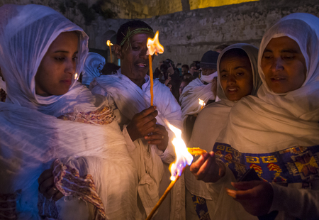 JERUSALEM - APRIL 15 : Ethiopian Orthodox pilgrims participates in the Holy fire ceremony at the Ethiopian section of the Holy Sepulcher in Jerusalm Israel on April 15 2017のeditorial素材