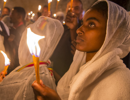 JERUSALEM - APRIL 15 : Ethiopian Orthodox pilgrims participates in the Holy fire ceremony at the Ethiopian section of the Holy Sepulcher in Jerusalm Israel on April 15 2017のeditorial素材
