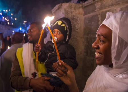 JERUSALEM - APRIL 15 : Ethiopian Orthodox pilgrims participates in the Holy fire ceremony at the Ethiopian section of the Holy Sepulcher in Jerusalm Israel on April 15 2017のeditorial素材