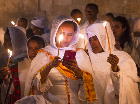 JERUSALEM - APRIL 15 : Ethiopian Orthodox pilgrims participates in the Holy fire ceremony at the Ethiopian section of the Holy Sepulcher in Jerusalm Israel on April 15 2017のeditorial素材