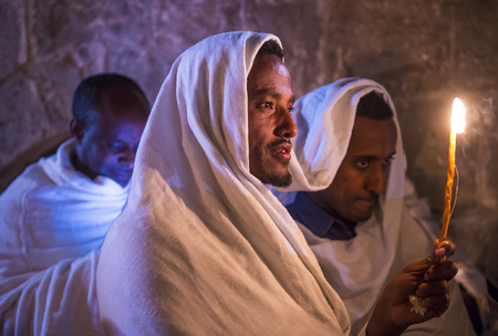 JERUSALEM - APRIL 15 : Ethiopian Orthodox pilgrims participates in the Holy fire ceremony at the Ethiopian section of the Holy Sepulcher in Jerusalm Israel on April 15 2017のeditorial素材