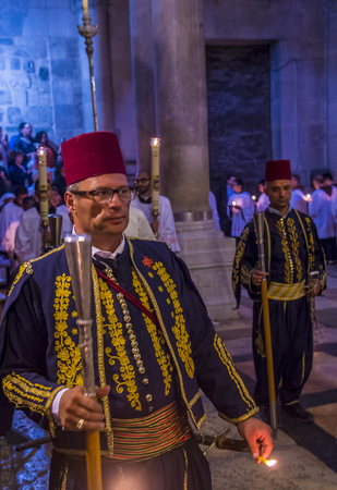 JERUSALEM - APRIL 13 : A procession of monks holding candels during Easter in the church of the holy sepulcher in Jerusalem Israel on April 13 2017のeditorial素材