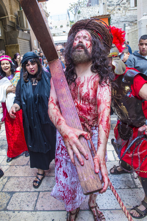 JERUSALEM - APRIL 14 : Christian pilgrims re-enact the crucifixtion of Jesus along the Via Dolorosa in Jerusalem during Good friday on April 14 2017のeditorial素材