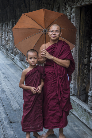 MANDALAY , MYANMAR - SEP 02 : Monks at Shwenandaw Monastery in Mandalay, Myanmar on September 02 2017. Shwenandaw Monastery is a historic monastery located near Mandalay Hillのeditorial素材