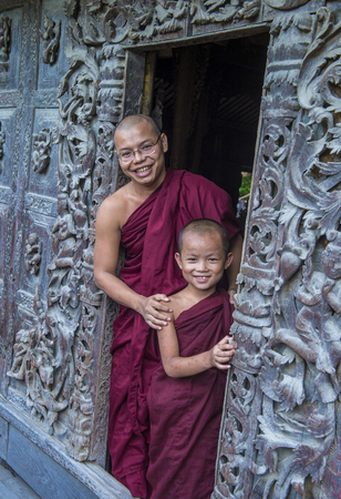 MANDALAY , MYANMAR - SEP 02 : Monks at Shwenandaw Monastery in Mandalay, Myanmar on September 02 2017. Shwenandaw Monastery is a historic monastery located near Mandalay Hillのeditorial素材