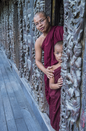 MANDALAY , MYANMAR - SEP 02 : Monks at Shwenandaw Monastery in Mandalay, Myanmar on September 02 2017. Shwenandaw Monastery is a historic monastery located near Mandalay Hillのeditorial素材